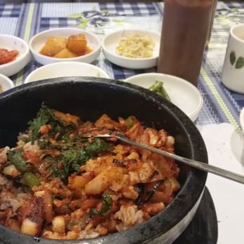 Delicious Table - Octopus in hot stone pot with rice and veggies, with complementary side dishes - Korean Near Me - Buena Park, California Delicious Table - Octopus in hot stone pot with rice and veggies, with complementary side dishes - Korean Near Me - Buena Park, California