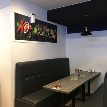 Punjabi Tadka - a table and benches in a restaurant - Indian Near Me - Brampton, Ontario Punjabi Tadka - a table and benches in a restaurant - Indian Near Me - Brampton, Ontario