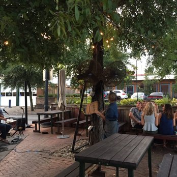 Oddfellows - Outdoor patio under a tee with lights live music - Breakfast & Brunch Near Me - Dallas, Texas