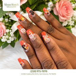 Nails & Spa Alamo Ranch - Spooky autumn cuties! Coffin nails pair vibrant glossy orange with playful cartoon ghosts, bats, pumpkins, and sparkle stars. Book today!