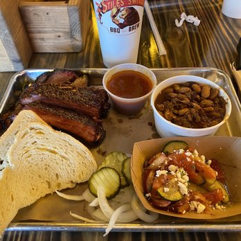 Stiles Switch BBQ & Brew - Brisket, ribs, beans, cucumber and tomato salad - Barbeque Near Me - Cedar Park, Texas Stiles Switch BBQ & Brew - Brisket, ribs, beans, cucumber and tomato salad - Barbeque Near Me - Cedar Park, Texas