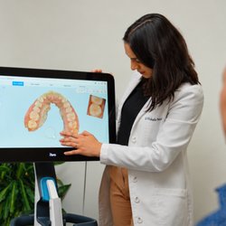 Edge Dental Designs - Dr. Vishala Patel uses advanced 3D dental imaging to explain personalized treatment options in McKinney, near Prosper, TX.
