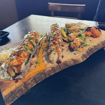 Modesto Sukiyaki - Left to Right: Lion King Roll ($15), Rock-N-Roll ($15), Baked Mussels ($10, Spicy Salmon ($8) - Sushi Bars Near Me - Modesto, California