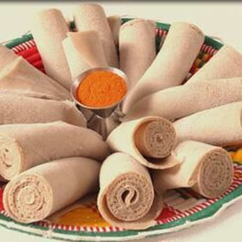Muya Restaurant - a platter of rolled up rolls of food - Ethiopian Near Me - Kitchener, Ontario