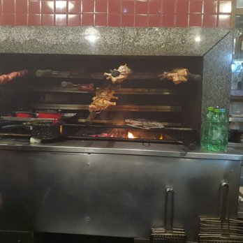 Galeto Sat's - The meat being prepared. Fire. The food is amazing. Steak was great. Wanted to try the chicken heart but was afraid lol. - Dive Bars Near Me - Rio de Janeiro, RJ Galeto Sat's - The meat being prepared. Fire. The food is amazing. Steak was great. Wanted to try the chicken heart but was afraid lol. - Dive Bars Near Me - Rio de Janeiro, RJ