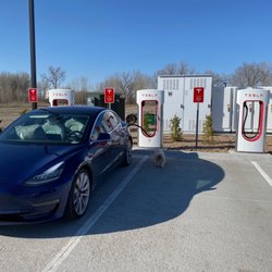 Tesla Supercharger - Gothenburg, Nebraska tesla supercharging station behind the comfort suites
