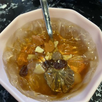 Chuan Chuan Bar - a bowl of soup with a spoon - Hot Pot Near Me - Toronto, Ontario