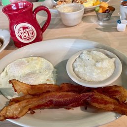 Two Eggs & a Cake (eggs over medium, crispy bacon & grits) Two Eggs & a Cake (eggs over medium, crispy bacon & grits)