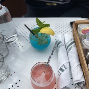 Lapisara Eatery - The blue mojito and the 698 (lavender, hibiscus and champagne) - Breakfast & Brunch Near Me - San Francisco, California Lapisara Eatery - The blue mojito and the 698 (lavender, hibiscus and champagne) - Breakfast & Brunch Near Me - San Francisco, California