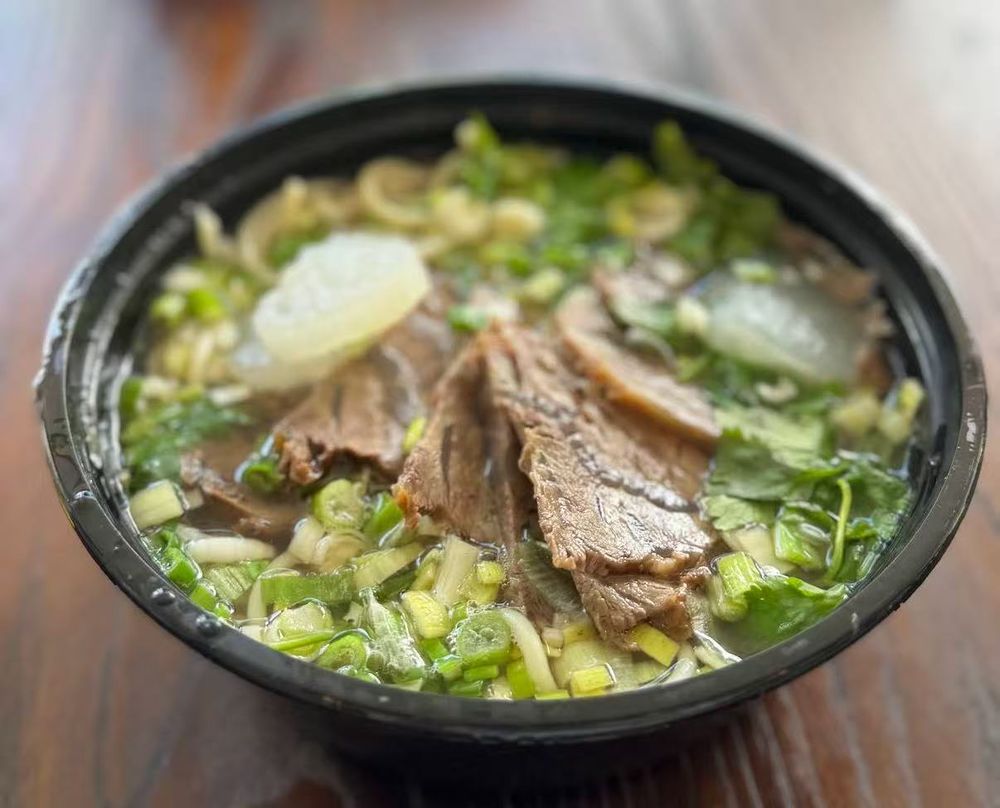 Dumplings To Go Logo