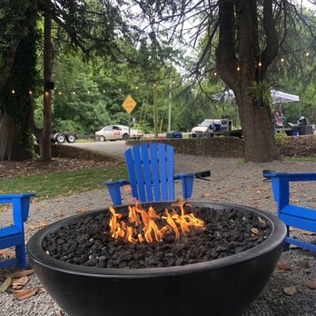 Elkin RailYard - a fire pit with blue chairs - Beer Gardens Near Me - Elkin, North Carolina