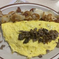 Three egg omelet (sausage, mushroom, and American cheese) with home fries