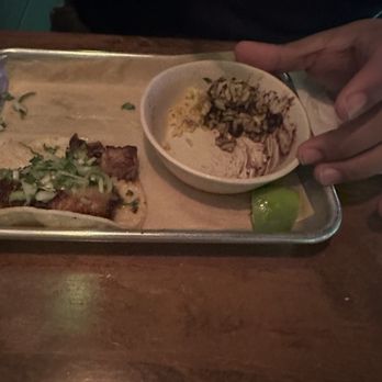 Masa Taco Bar - Half eaten Pork Belly Tacos and the rice and beans. - Mexican Near Me - Stamford, Connecticut Masa Taco Bar - Half eaten Pork Belly Tacos and the rice and beans. - Mexican Near Me - Stamford, Connecticut