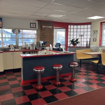 Andy's Drive-In - a woman sitting at the counter - American Near Me - Kenosha, Wisconsin Andy's Drive-In - a woman sitting at the counter - American Near Me - Kenosha, Wisconsin