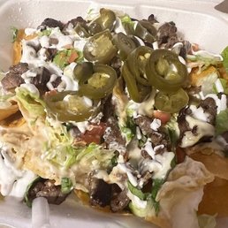 Steak nachos (I'm satiated, & I haven't gotten to the bottom of the bowl yet!) Steak nachos (I'm satiated, & I haven't gotten to the bottom of the bowl yet!)