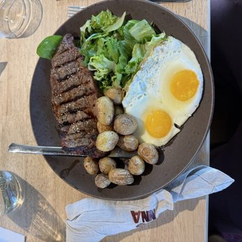 Monna - Grilled steak with eggs, roasted baby potatoes, and fresh greens. - Middle Eastern Near Me - La Crescenta-Montrose, California Monna - Grilled steak with eggs, roasted baby potatoes, and fresh greens. - Middle Eastern Near Me - La Crescenta-Montrose, California
