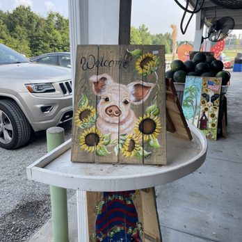 The Berry Patch - a pig and sunflowers painted on wood planks - Ice Cream & Frozen Yogurt Near Me - Ellerbe, North Carolina