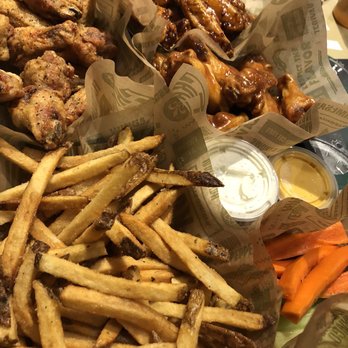 Wingstop - Clockwise from top left are lemon pepper, Korean, Hawaiian, and veges - Chicken Wings Near Me - Manassas, Virginia Wingstop - Clockwise from top left are lemon pepper, Korean, Hawaiian, and veges - Chicken Wings Near Me - Manassas, Virginia