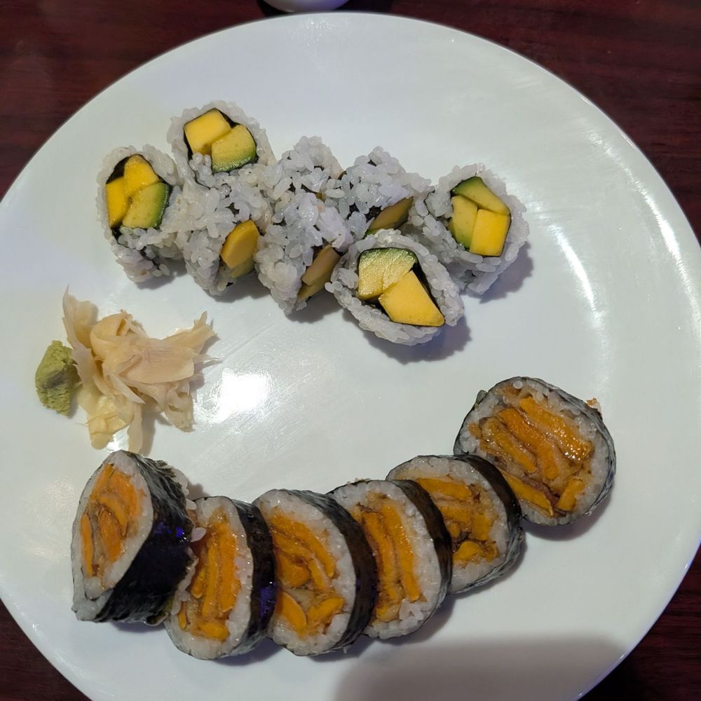 Mango sushi roll and sweet potato tempura sushi roll. Both vegetarian Mango sushi roll and sweet potato tempura sushi roll. Both vegetarian