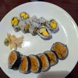 Mango sushi roll and sweet potato tempura sushi roll. Both vegetarian