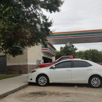 7-Eleven - a white car parked in front of a gas station - Convenience Stores Near Me - Sarasota, Florida
