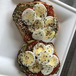 Avocado toast on asagio cheese bagel