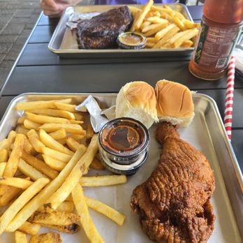 Fryer's Roadside - Foreground: 1/4 fried chicken, fries and rolls. Background ribs. - Chicken Shop Near Me - Silver Spring, Maryland