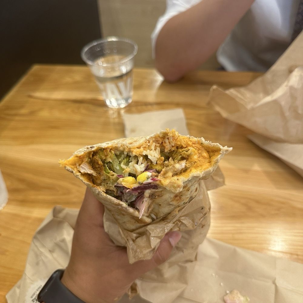Chicken/steak pita with saffron rice, red pepper hummus, tzatziki, fire roasted corn, cabbage slaw, lemon tahini dressing, garlic dressing. Chicken/steak pita with saffron rice, red pepper hummus, tzatziki, fire roasted corn, cabbage slaw, lemon tahini dressing, garlic dressing.