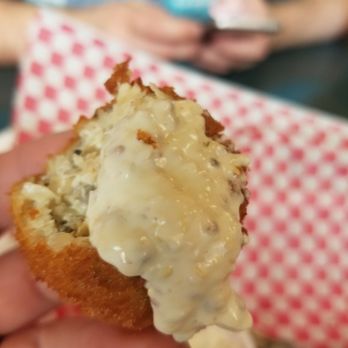 Powerhouse Brewing - a person holding a half eaten donut - Bars Near Me - Columbus, Indiana Powerhouse Brewing - a person holding a half eaten donut - Bars Near Me - Columbus, Indiana