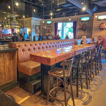 Jack Saloon - a bar with leather booths and bar stools - Bars Near Me - Brossard, Quebec