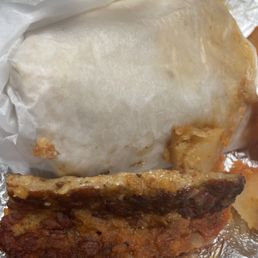 a half eaten burger and half eaten ice cream