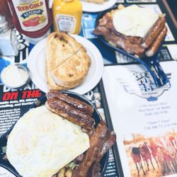 Breezy’s Wings and Wheels Restaurant - 2x Valeigh Skillet w/cntry potatoes, ham, bells, onions, mushrms, tomatoes, cheese, 2 eggs, 2 sausage, 2 bacon, 2 sourdough bread.