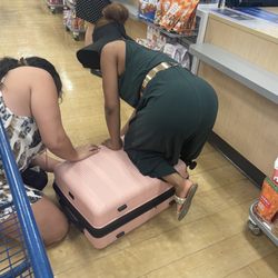 Marshalls - A Good Samaritan helping me stuff my new suitcase