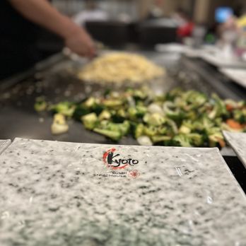 Kyoto - a chef preparing a meal in a restaurant - Sushi Bars Near Me - Yakima, Washington