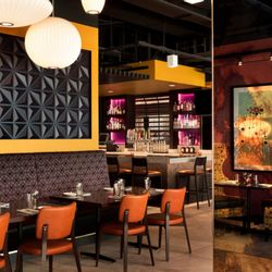 Citizen Saint Paul - The dining area and bar exude a space-age look, featuring sleek, futuristic furniture and a minimalist design.