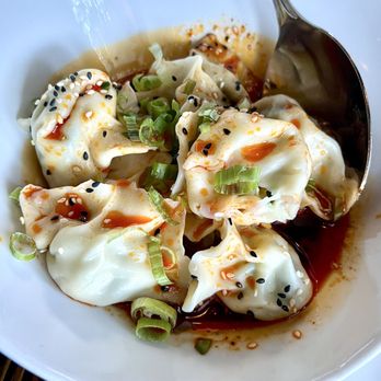 Tyger Tyger - Prawn & Chive Dumpling: 8 hand-rolled dumplings with prawn, chive & egg topped with aromatic black vinegar chili oil - Szechuan Near Me - Seattle, Washington