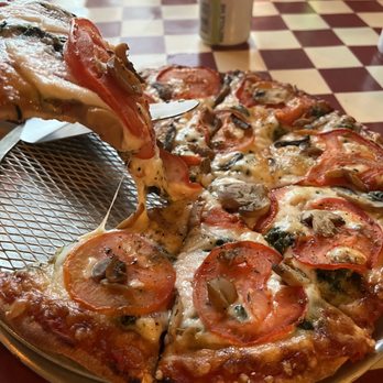 Luigi's Pizza & Pasta - a slice being taken out of a pizza - Pizza Near Me - Plainfield, Illinois Luigi's Pizza & Pasta - a slice being taken out of a pizza - Pizza Near Me - Plainfield, Illinois