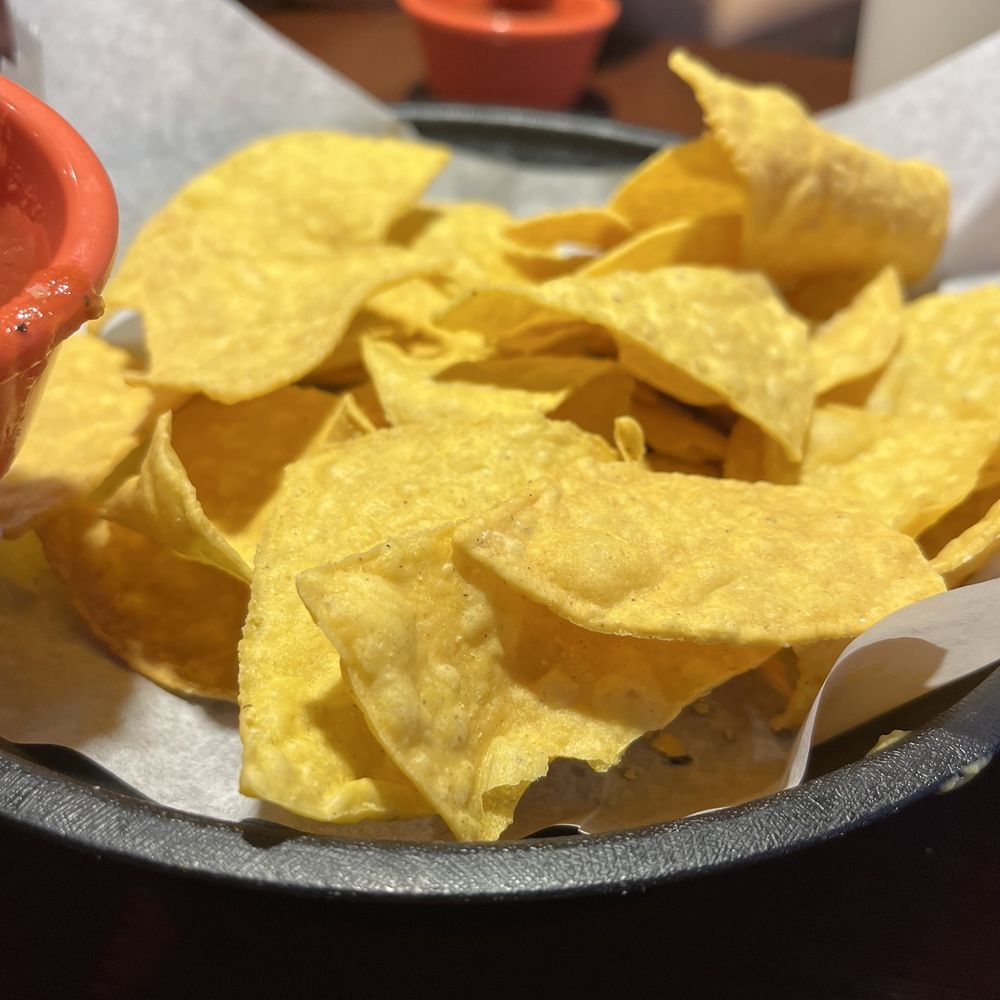 Cinco de Mayo - a plate of chips and a bowl of salsa - Mexican Near Me - Concord, North Carolina