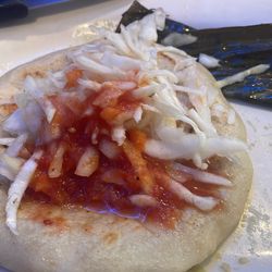 Rincon Guanaco Restaurant - Pupusa de queso con loroco.  No flavor on the tomato sauce or the curtido.
