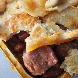 Smoked brisket pot pie in a beefy BBQ gravy with a flaky crust.