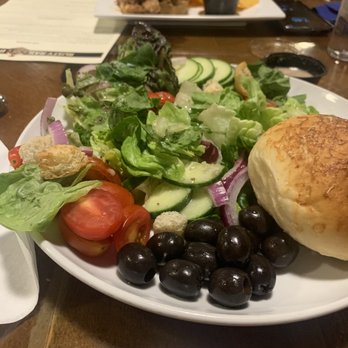 Rusty Rail Brewery - Basic Greens Salad in foreground, pulled pork with chips in background. - Breweries Near Me - Mifflinburg, Pennsylvania Rusty Rail Brewery - Basic Greens Salad in foreground, pulled pork with chips in background. - Breweries Near Me - Mifflinburg, Pennsylvania