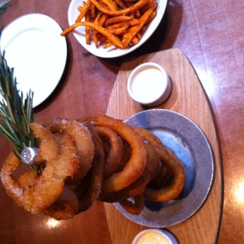 Yard House - Onion Ring Stack and sweet potato fries - Bars Near Me - Roseville, California Yard House - Onion Ring Stack and sweet potato fries - Bars Near Me - Roseville, California
