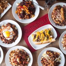 Restaurant Poutineville Vieux Québec - A vast variety of poutines showcased, complemented by a tasty submarine!