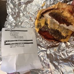 a hamburger wrapped in aluminum foil a hamburger wrapped in aluminum foil