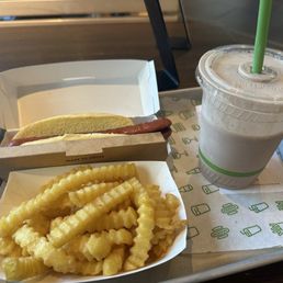 Classic hot dog, fries, and black and white shake