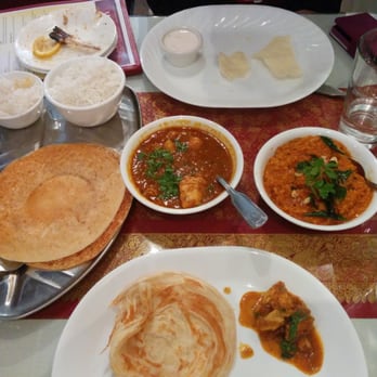 Aahaar an Indian Eatery - The complete meal - Chettinad pepper chicken, Malabar parotta, Kal dosa and Bisibelebath - Indian Near Me - Snoqualmie, Washington