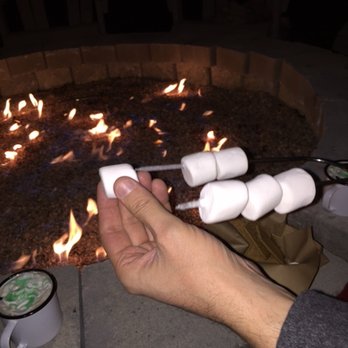 Park & Field - Making s'mores by the firepit - New American Near Me - Chicago, Illinois Park & Field - Making s'mores by the firepit - New American Near Me - Chicago, Illinois