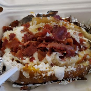 Elote - Baked potato. Cheese, butter, more cheese, spur cream and bacon. You can also add any of their meats. - Mexican Near Me - Escondido, California Elote - Baked potato. Cheese, butter, more cheese, spur cream and bacon. You can also add any of their meats. - Mexican Near Me - Escondido, California