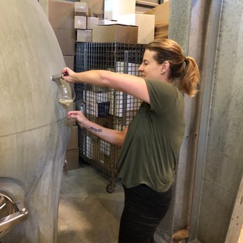 Cuvaison - Leslie pouring from the egg - Wineries Near Me - Napa, California