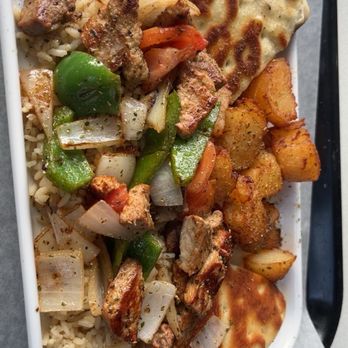 Nikkos Grecian Grill - Pork Kebob plate platter - potatoes well done - Greek Near Me - Mundelein, Illinois Nikkos Grecian Grill - Pork Kebob plate platter - potatoes well done - Greek Near Me - Mundelein, Illinois